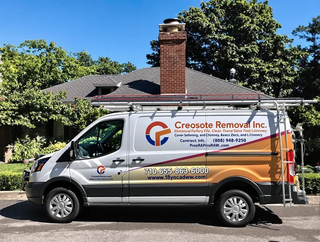 Littleton Chimney Sweep technician removing creosote safely in Littleton, MA