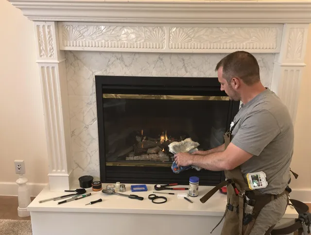 Littleton Chimney Sweep performing fireplace maintenance in Littleton, MA